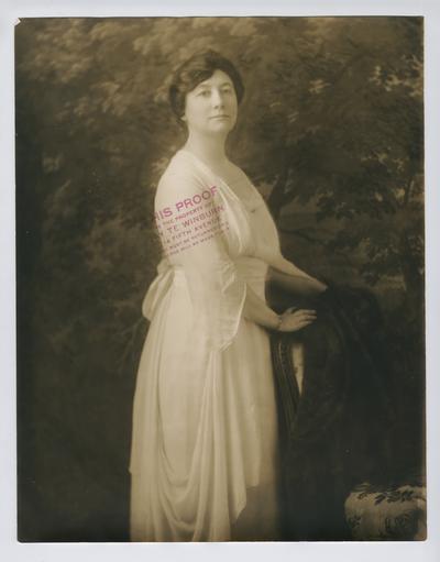 Portrait proof of Cora Wilson Stewart facing right, standing at a chair