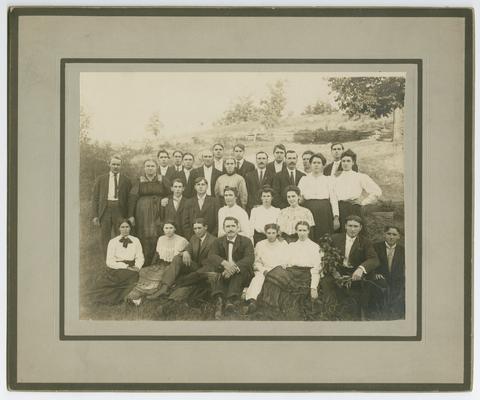 Unidentified adult students posing outside