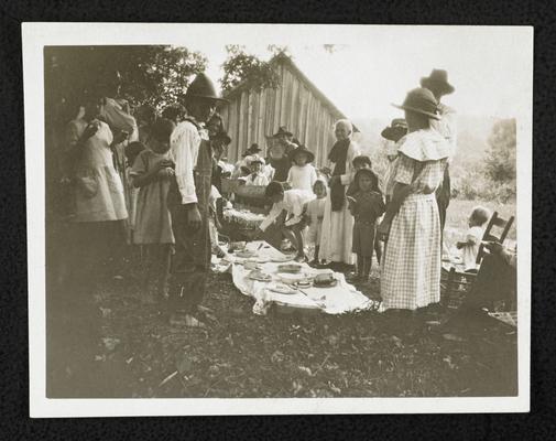 Alabama students. Back of the photograph reads: All day meeting and dinner on the grounds. Reaves School, Calhoun County, 1923. School enrollment 50