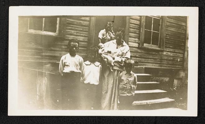 Kentucky students. Back of the photograph reads: This lady walked 3/4 miles and carried her three months old baby and three other children to attend Fredega Adult School. She was there every day but one. Calhoun County