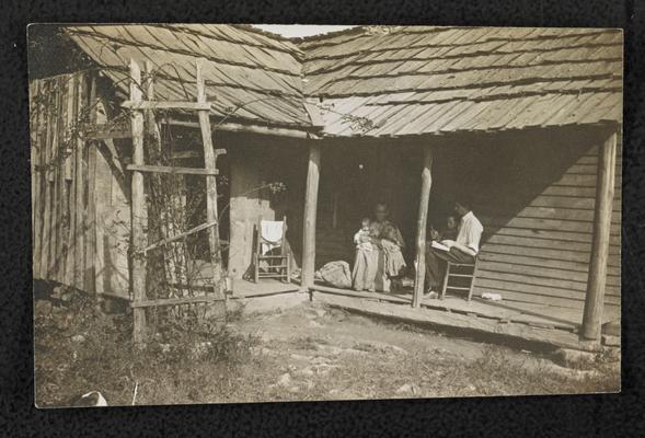 Lady, the mother of 6 children, being taught in the home department by J.J. Ashler. She said that she wanted to learn so she could read the Bible