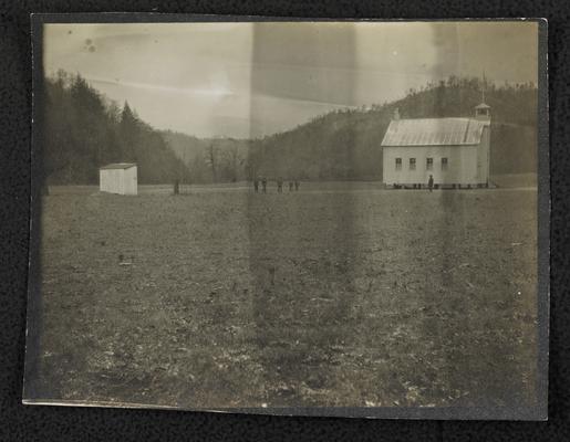 School house, location unidentified. Unidentified children standing outside