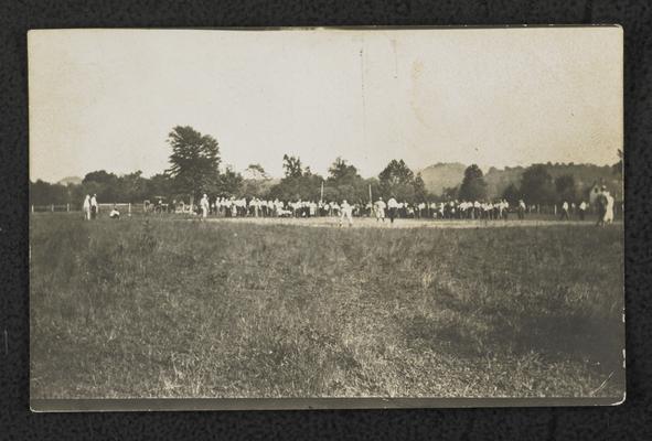 A far view of a crowd watching a baseball game