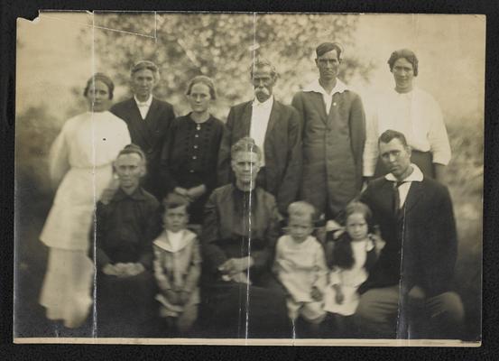 Group, unidentified. 3 children sitting on a bench, 6 women, and 2 men