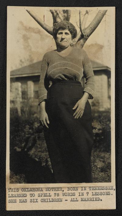 Oklahoma students. Back of the photograph reads: This Oklahoma mother, born in Tennessee, learned to spell 78 words in 7 lessons. She has six children-all married