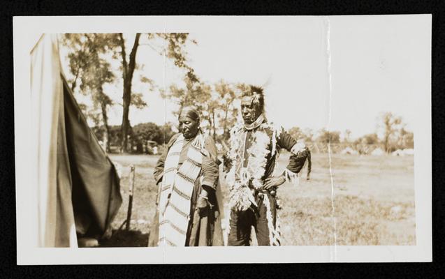 A man and woman in traditional Native American dress