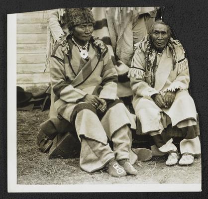 Two men in traditional Native American dress