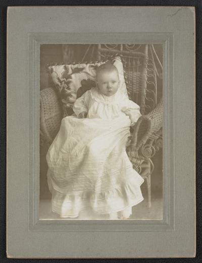 Formal portrait of Cora Wilson Stewart as a baby in a christening gown