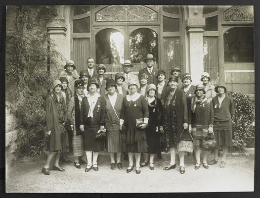 A group photograph with Cora Wilson Stewart, third from the left on the front row, many of the individuals are wearing medals. A larger group photograph is in item #68