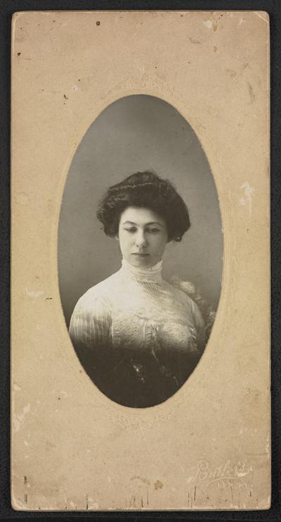 Formal portrait of Cora Wilson Stewart, taken at Butler's photograph studio in Lexington Kentucky. Back of the photograph reads: Mrs. Stewart as young girl