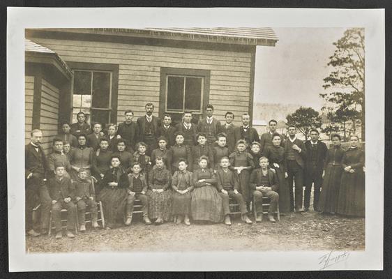 Kentucky students. Classroom photograph, posed in front of a building