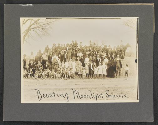 New Mexico students. Back of the photograph reads: A New Mexico moonlight and day school met together to boost moonlight schools