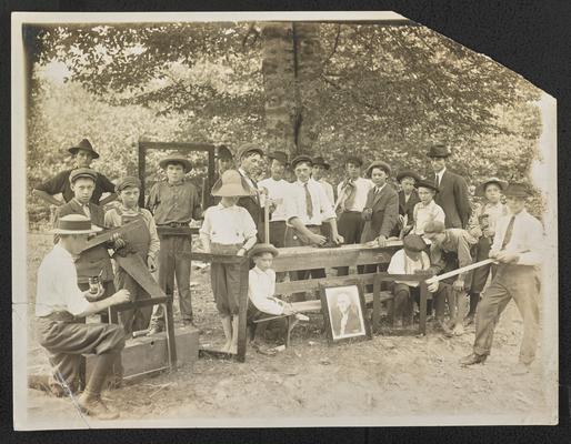 Male students makes wooden picture frames