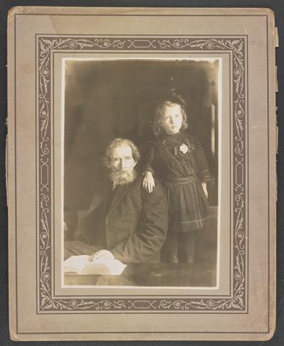 John Hatfield, back of the photograph reads: Grandfather, aged 94, in Moonlight School, learns to read and write. Granddaughter in day school, learns to read and write. Grayson County, Kentucky