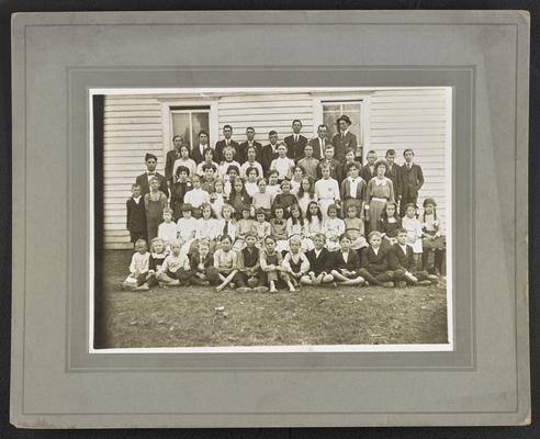 Kentucky students. Back of the photograph reads: Day School, Adair County, Azro Hadley, teacher