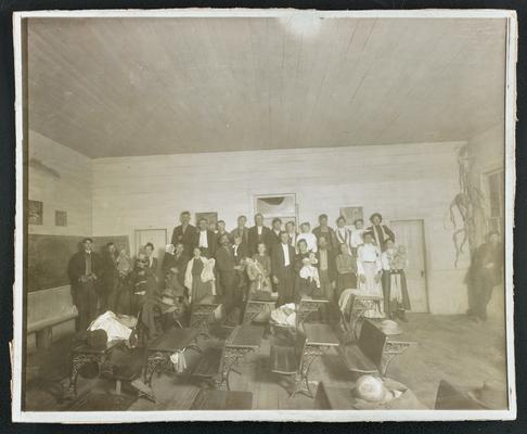 Kentucky students. Back of the photograph reads: Night School at New House, Rowan County, and they brought the babies along
