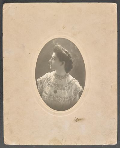 Formal portrait of Cora Wilson Stewart as a young woman, back of the photograph is stamped with Bush-Kred Co, Artists Engravers Electrotypers Printer & Supplies, Louisville, KY