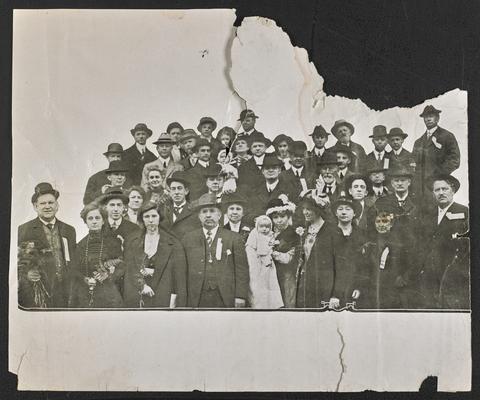 Large group photograph of men and women with Cora Wilson Stewart, just right of center on the first row