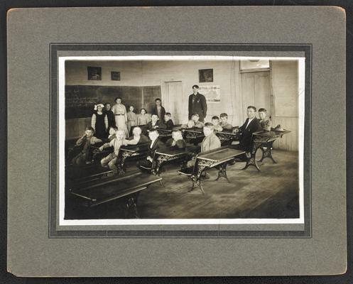 Kentucky students. Back of the photograph reads: He sat in the seat with his own 12-year-old-son