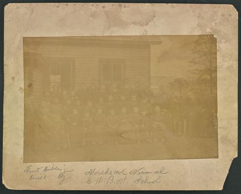 Kentucky students. Back of the photograph reads: First building built by Morehead Normal