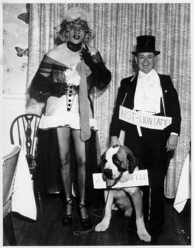 Adults; In Costume; Two people and one dog in costume