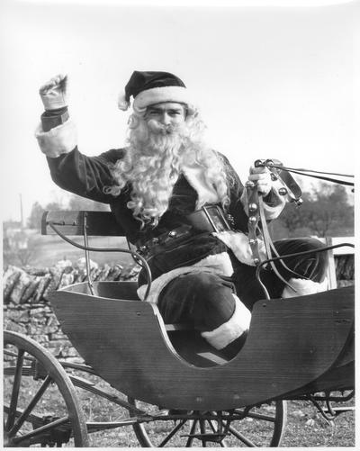 Adults; In Costume; Santa in sleigh/wagon