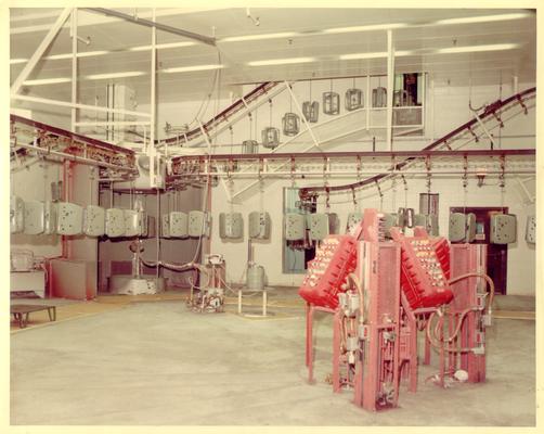 Advertising photographs; Large factory room with red control panel