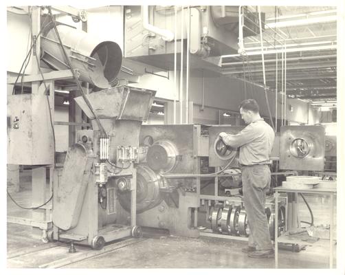 Advertising photographs; Man operating a Reeves brand machine