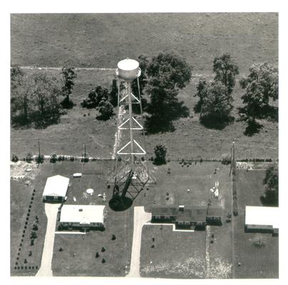 Aerial photographs; Aerial view of a water tower behind homes