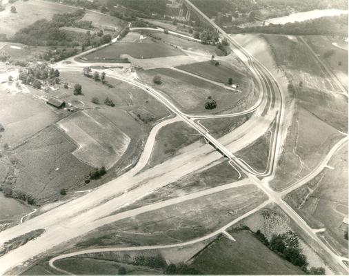 Aerial photographs; Aerial view of road construction near overpass and bridge; Same general scene shown in #66