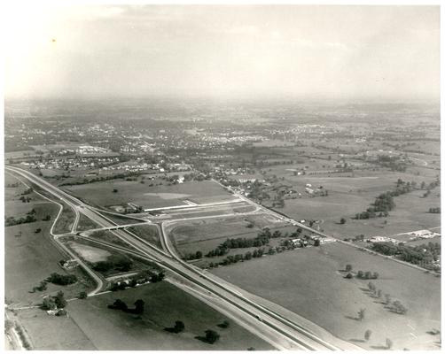 Aerial photographs; Aerial view of highway with overpass at junction of other roads, near residential area