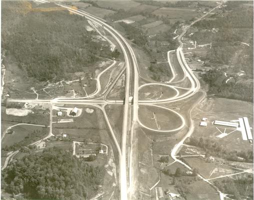 Aerial photographs; Aerial View of half of a clover leaf junction with a four-lane highway