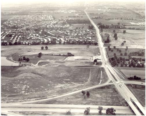 Aerial photographs; Aerial view of road construction and an overpass over four-lane highway