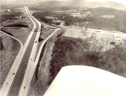 Aerial photographs; Aerial view of four-lane highway with overhead crossing of small road