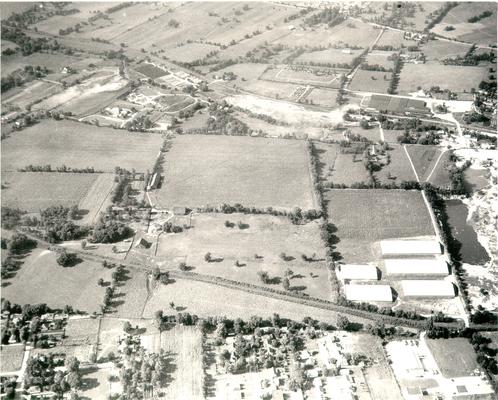 Aerial photographs; Aerial view of subdivision near farmland