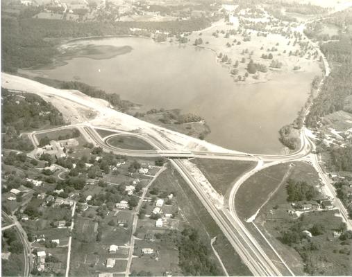 Aerial photographs; Aerial view of road construction near a small lake [MISSING]