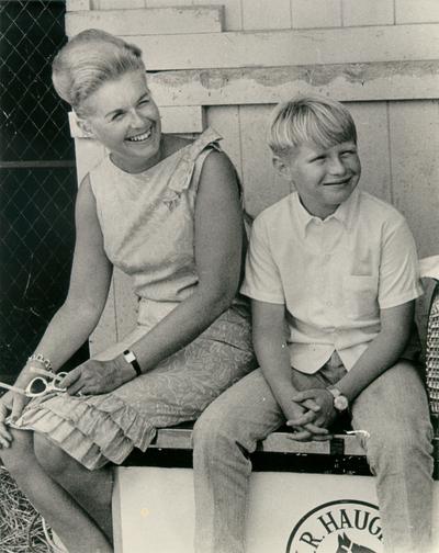 Horse Farms and Owners; C. V. Whitney Farm; Mother and son sitting down