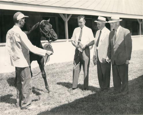 Horse Farms and Owners; Forest Retreat Farm; Three men speaking with an employee about a horse