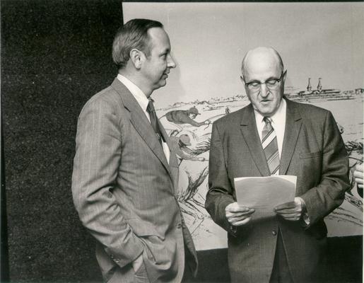 Horse Industry; Unidentified; Two men standing in front of a drawing of a horse