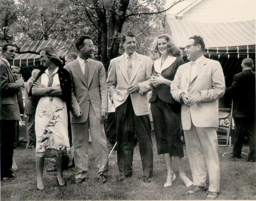 Horse Industry; Unidentified; Five people standing under a tree