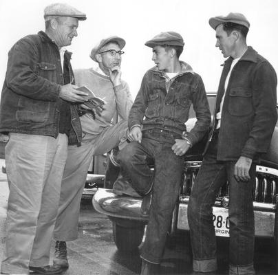 Horse Industry; Unidentified; Four men leaning on cars and talking