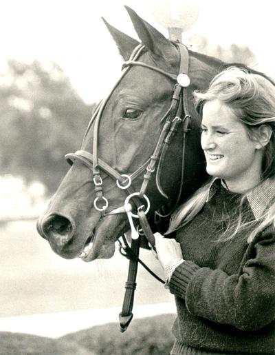 Horses; Single, Unidentified; Smiling girl with a horse