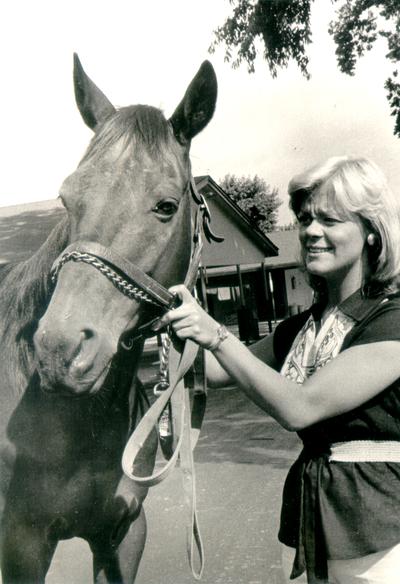 Horses; Single, Unidentified; Blinking woman with a horse