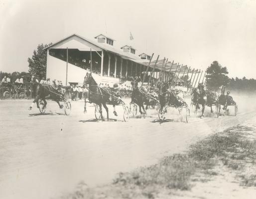 Horses; Harness Racing; Kentucky Association Track; Horses and drivers racing past the grandstand
