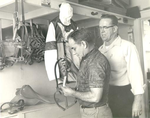 Horses; Harness Racing; The Red Mile; Two men looking at a harness for Tabano Wimpy