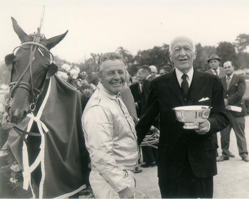 Horses; Harness Racing; Winner's Circle; Unidentified owners and horse in the Winner's Circle