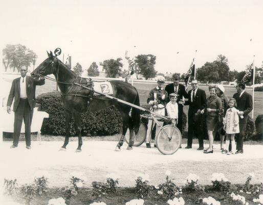 Horses; Harness Racing; Winner's Circle; Unidentified owners and horse in the Winner's Circle