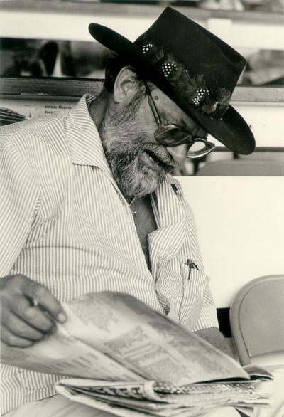 Horses; Thoroughbred Racing; Churchill Downs; Man in a Cowboy hat reading a racing form