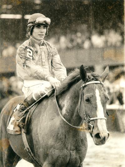 Horses; Thoroughbred Racing; Jockeys; A jockey riding in the rain