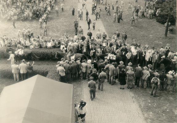 Horses; Thoroughbred Racing; Keeneland; Scenes at the Track; A crowd watches the horses enter the track